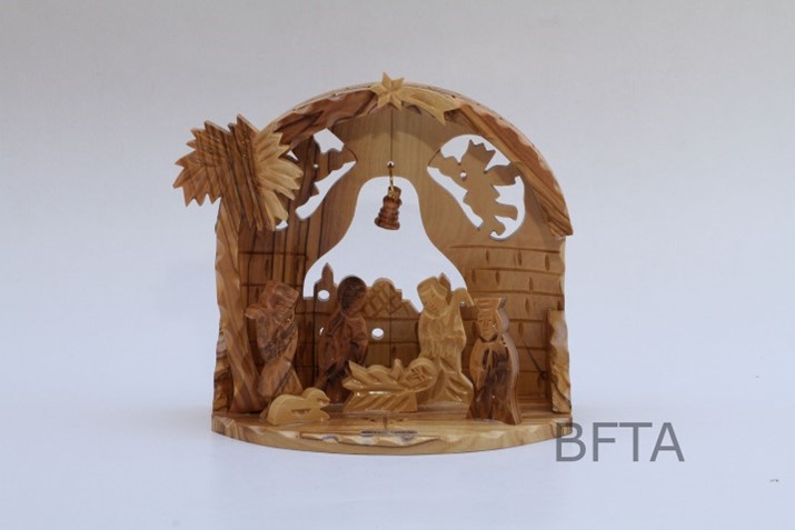 Nativity with curved roof and two angels in back